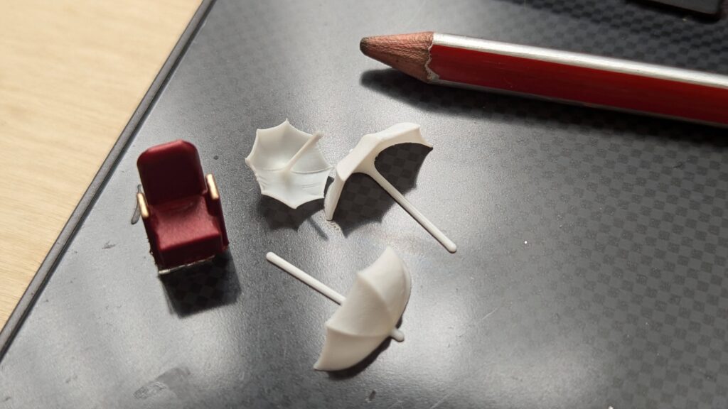 minature umbrellas next to a small theatre seat